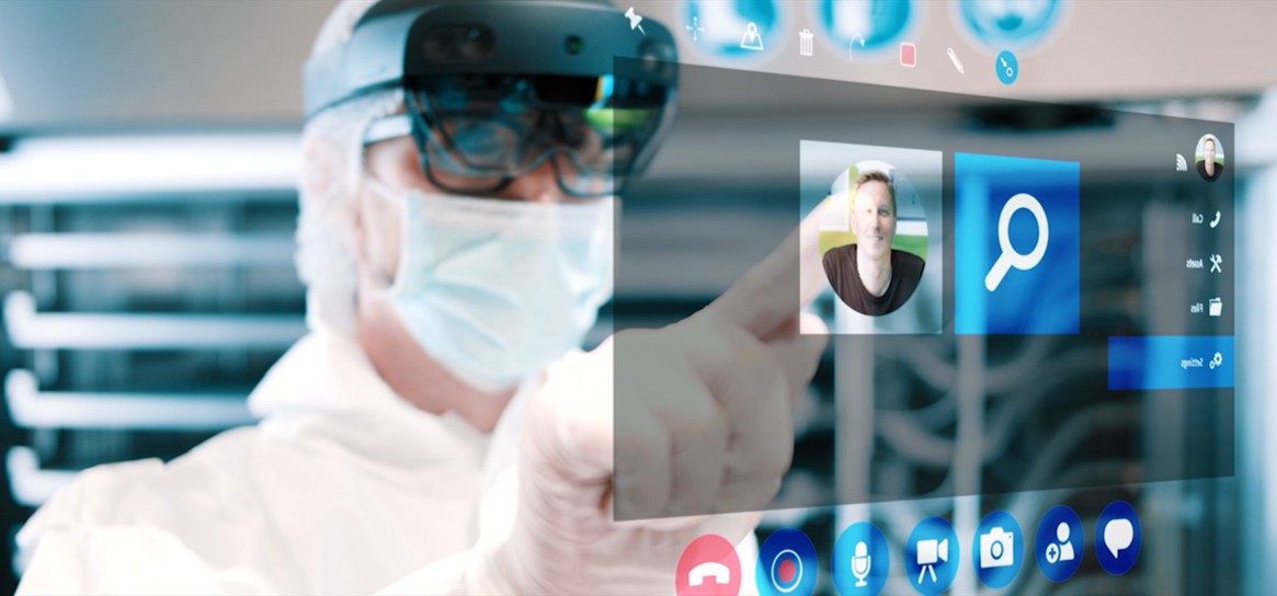 Person wearing goggles interacting with a futuristic interface.