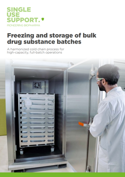 Person in a lab coat interacting with a large biopharma freezer