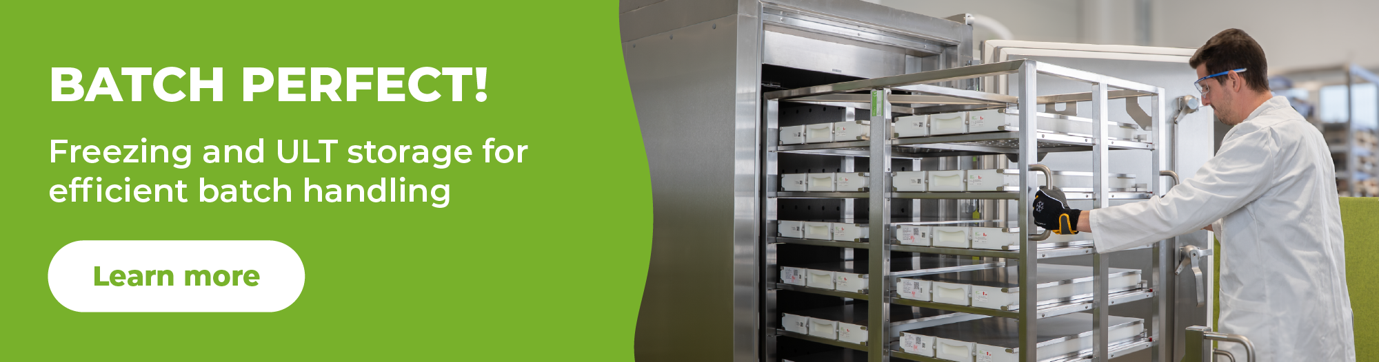 Promotional banner with a bright green left panel reading 'BATCH PERFECT! Freezing and ULT storage for efficient batch handling' and a white 'Learn more' button, alongside a photo of a person in a lab coat operating a stainless steel refrigeration rack in a clean industrial setting.