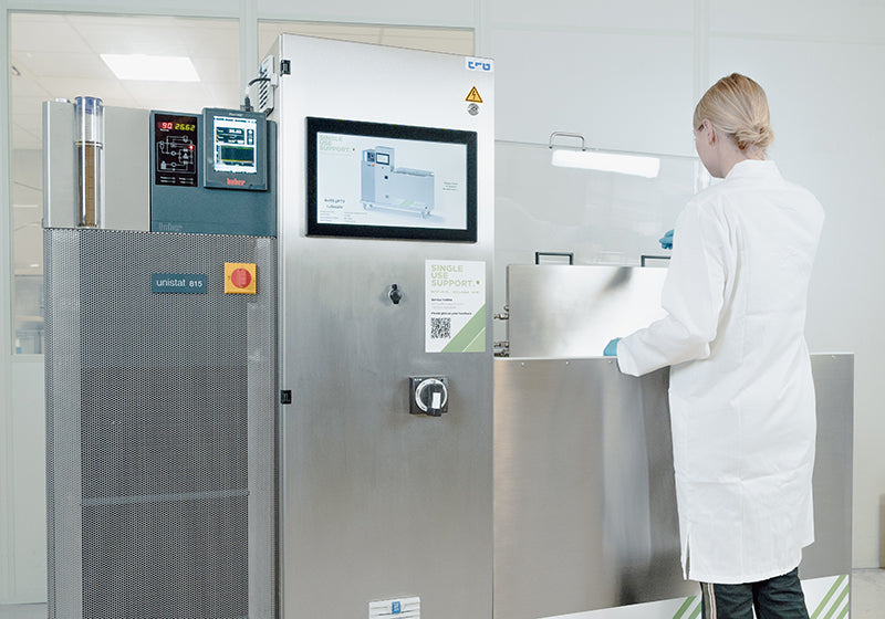 Mid-frame image of an operator using RoSS.pFTU Lab-Scale freezer for controlled freezing of cells or monoclonal antibodies (mAbs).
