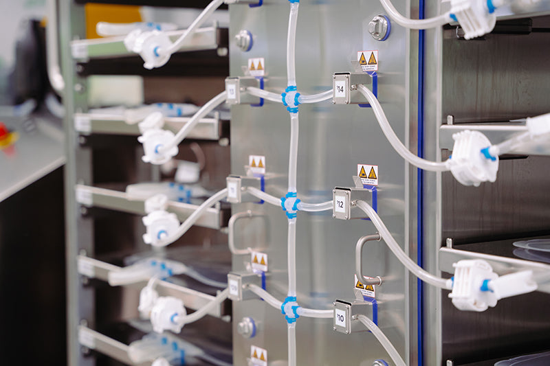 Close-up left-side view of advanced sealing pinch valves on a Single Use Support aseptic filling platform.