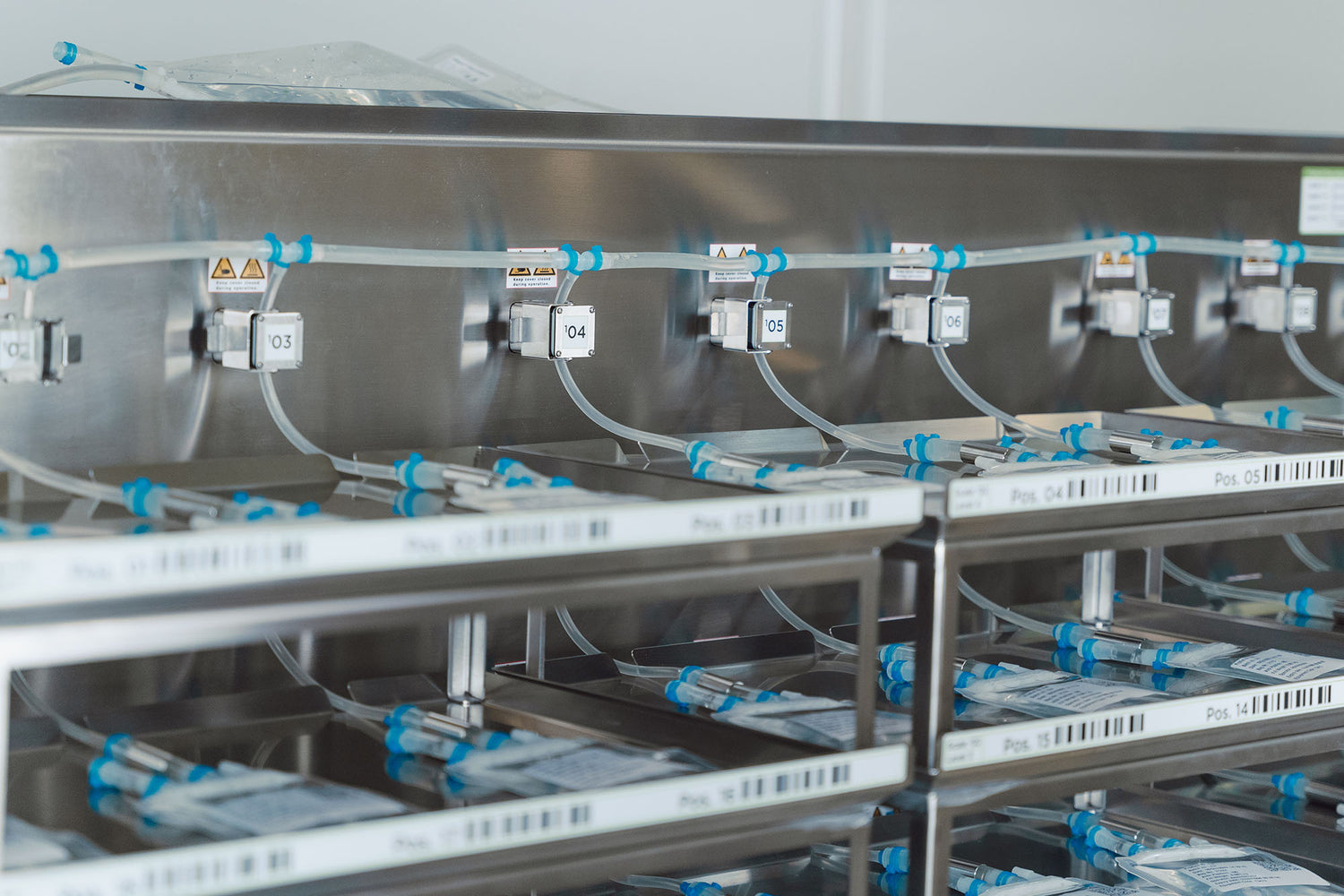 Close-up of small single-use bags during aseptic filling.